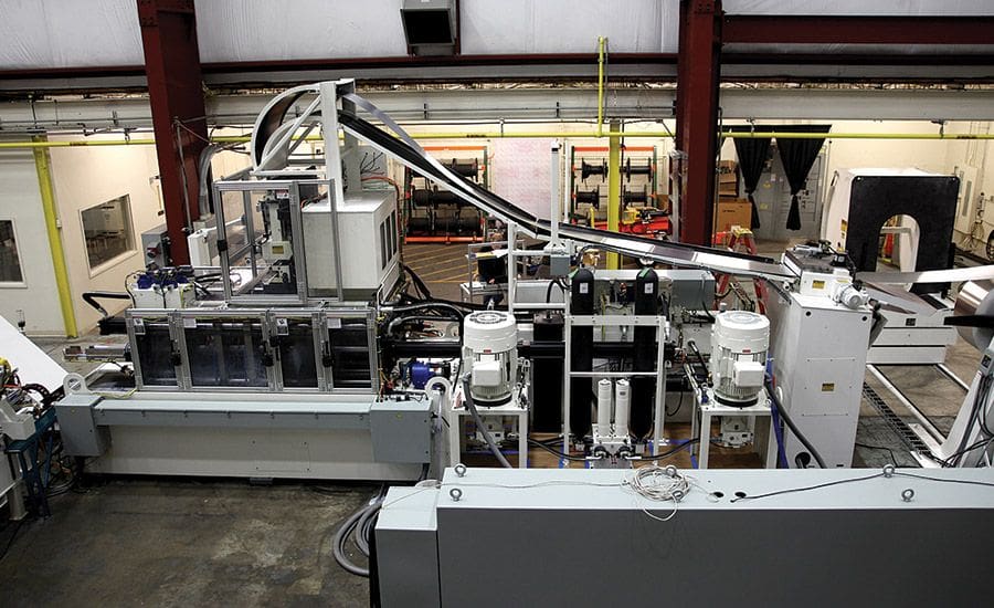 Custom press production line built by Neff Press, featured in FF Journal