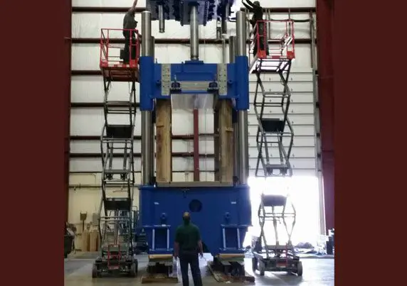 h2_12 A man standing in front of a large machine.