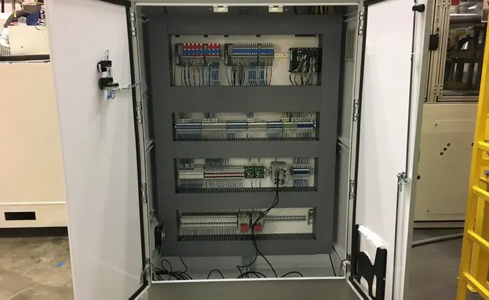 p4 A large electrical panel with many wires and switches.
