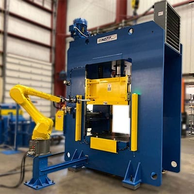 Column press with automatic robot feed into machine.