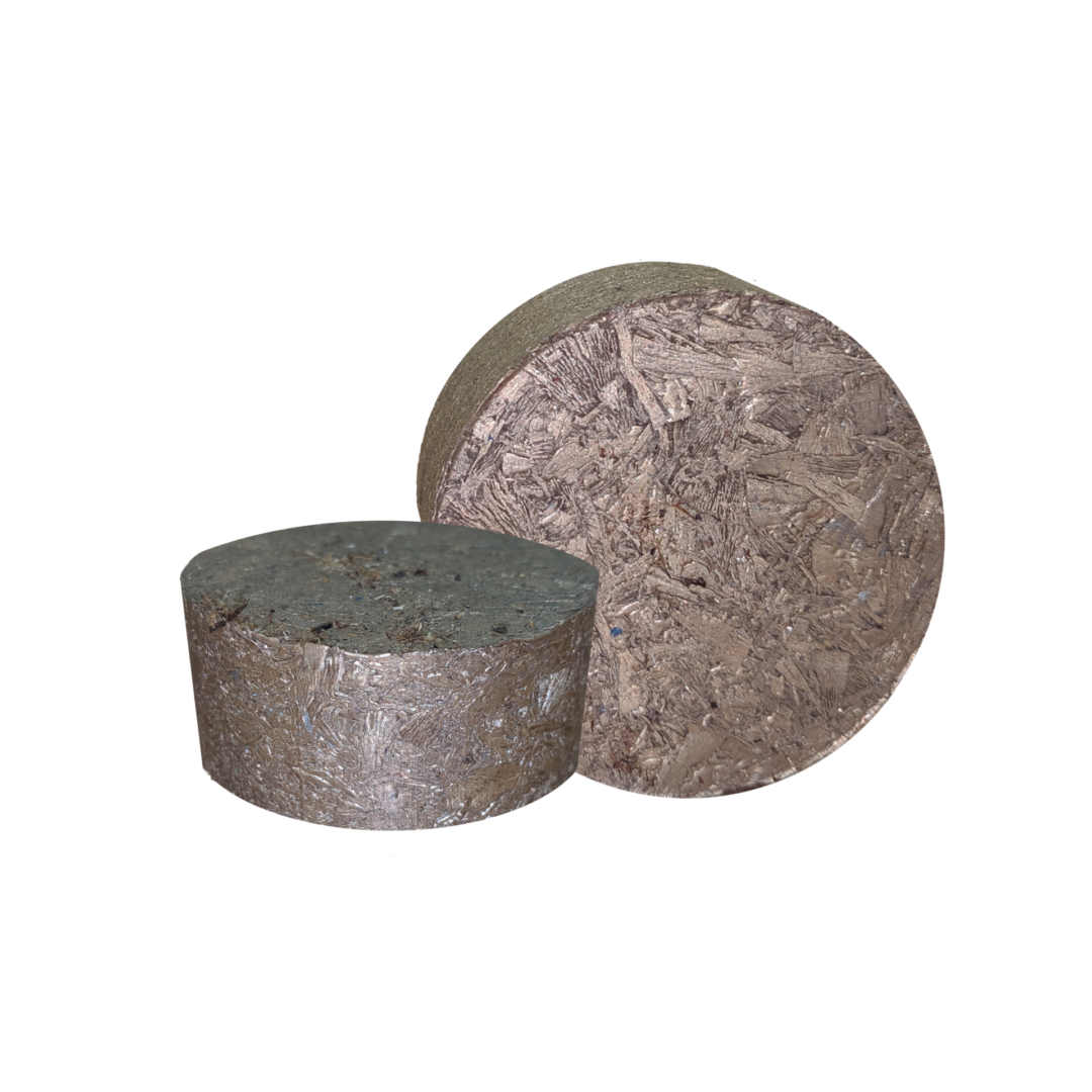 Neff Press MetalBrik metal briquette product showing compressed metal chip puck from top view